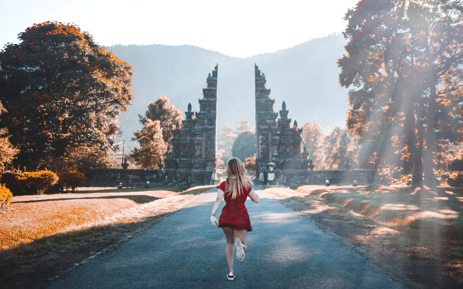 healing travel vs escape travel two paths fork in road concept in travel psychology
